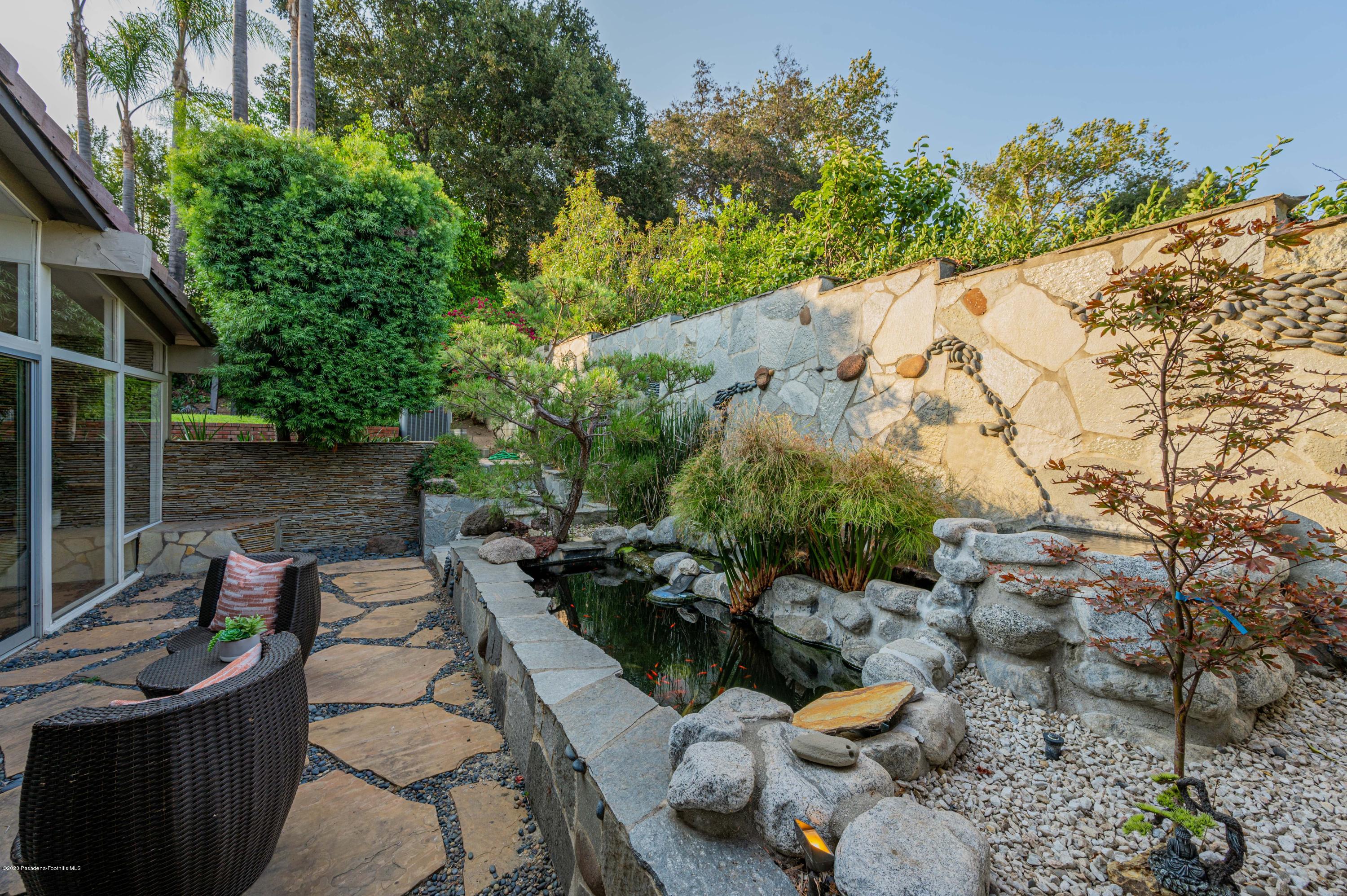 1225 Mesa Road San Marino, CA 91108 - Photo 15 of 48 a backyard of a house with lots of green space