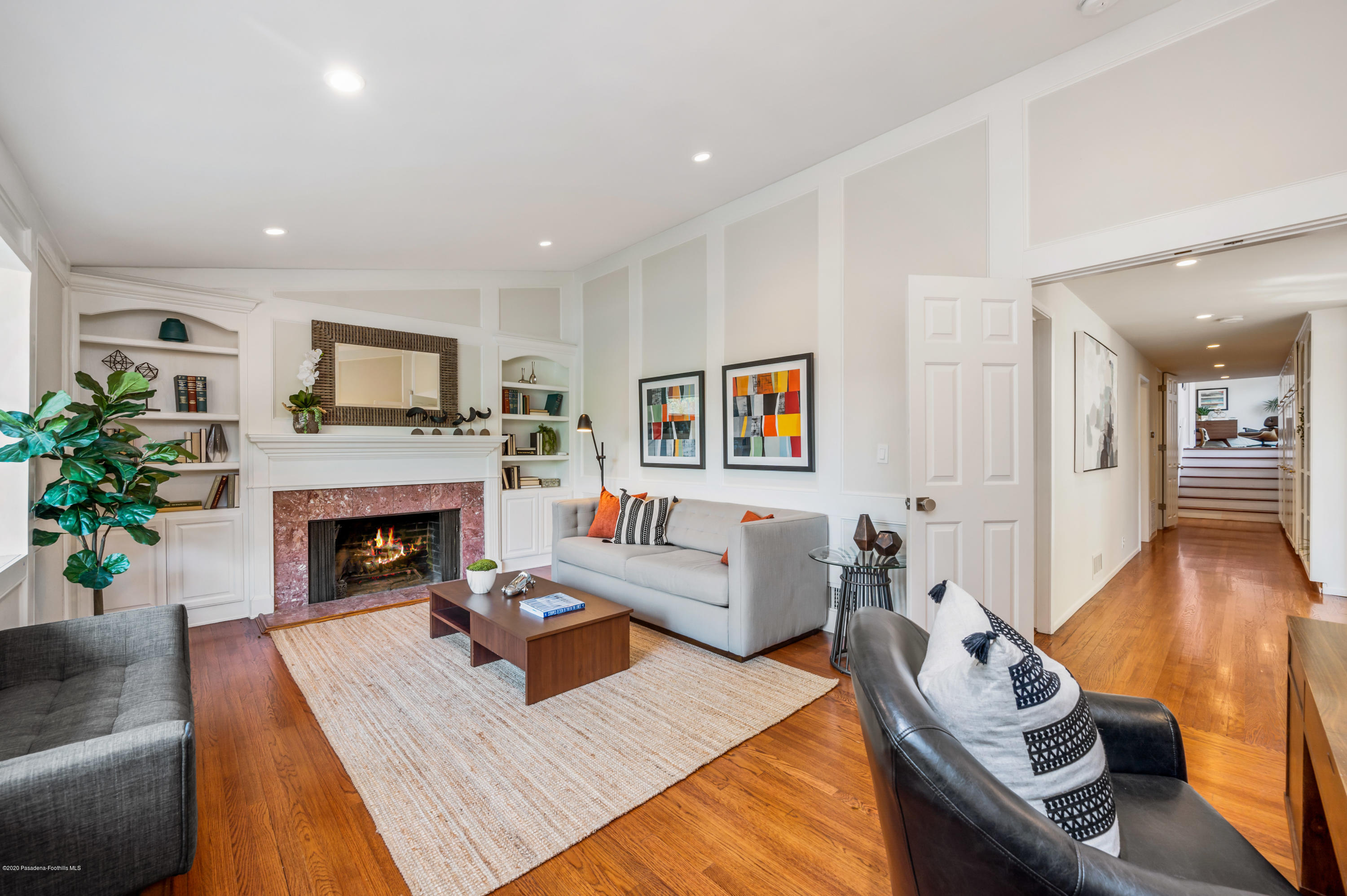 1225 Mesa Road San Marino, CA 91108 - Photo 17 of 48 a living room with furniture a fireplace and a flat screen tv