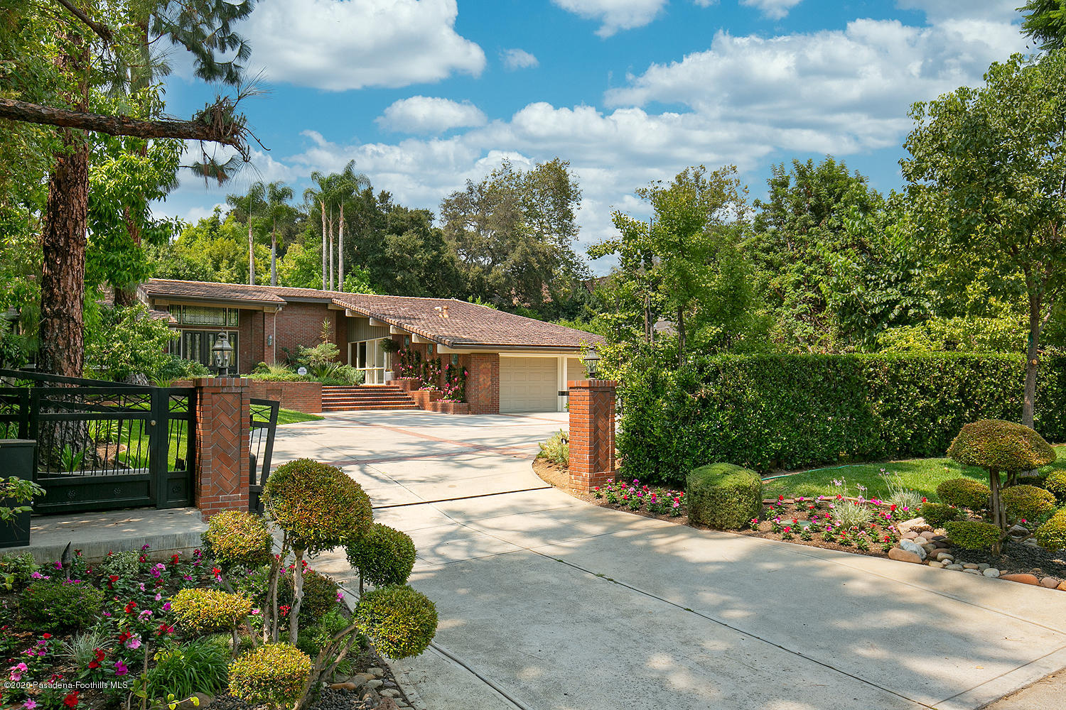 1225 Mesa Road San Marino, CA 91108 - Photo 3 of 48 a view of a house with backyard and a garden