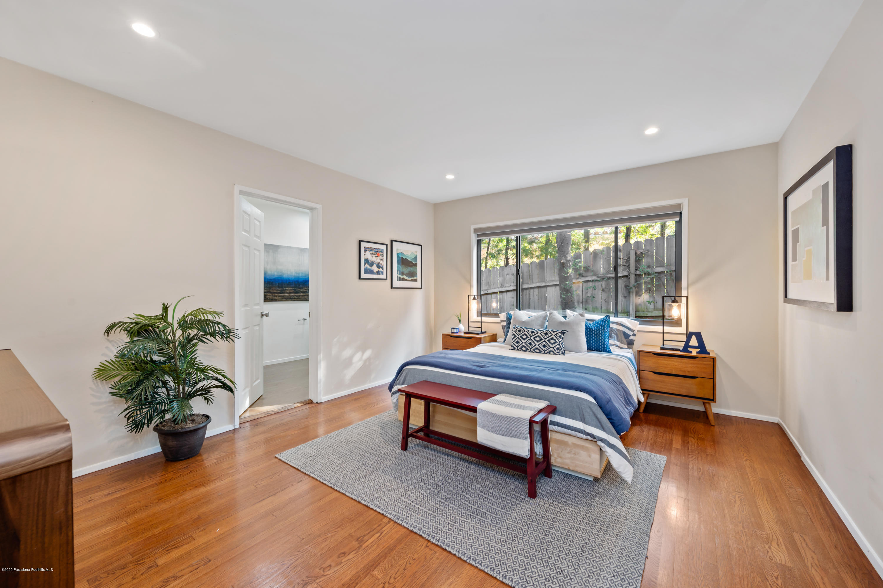 1225 Mesa Road San Marino, CA 91108 - Photo 23 of 48 a bedroom with furniture and a potted plant