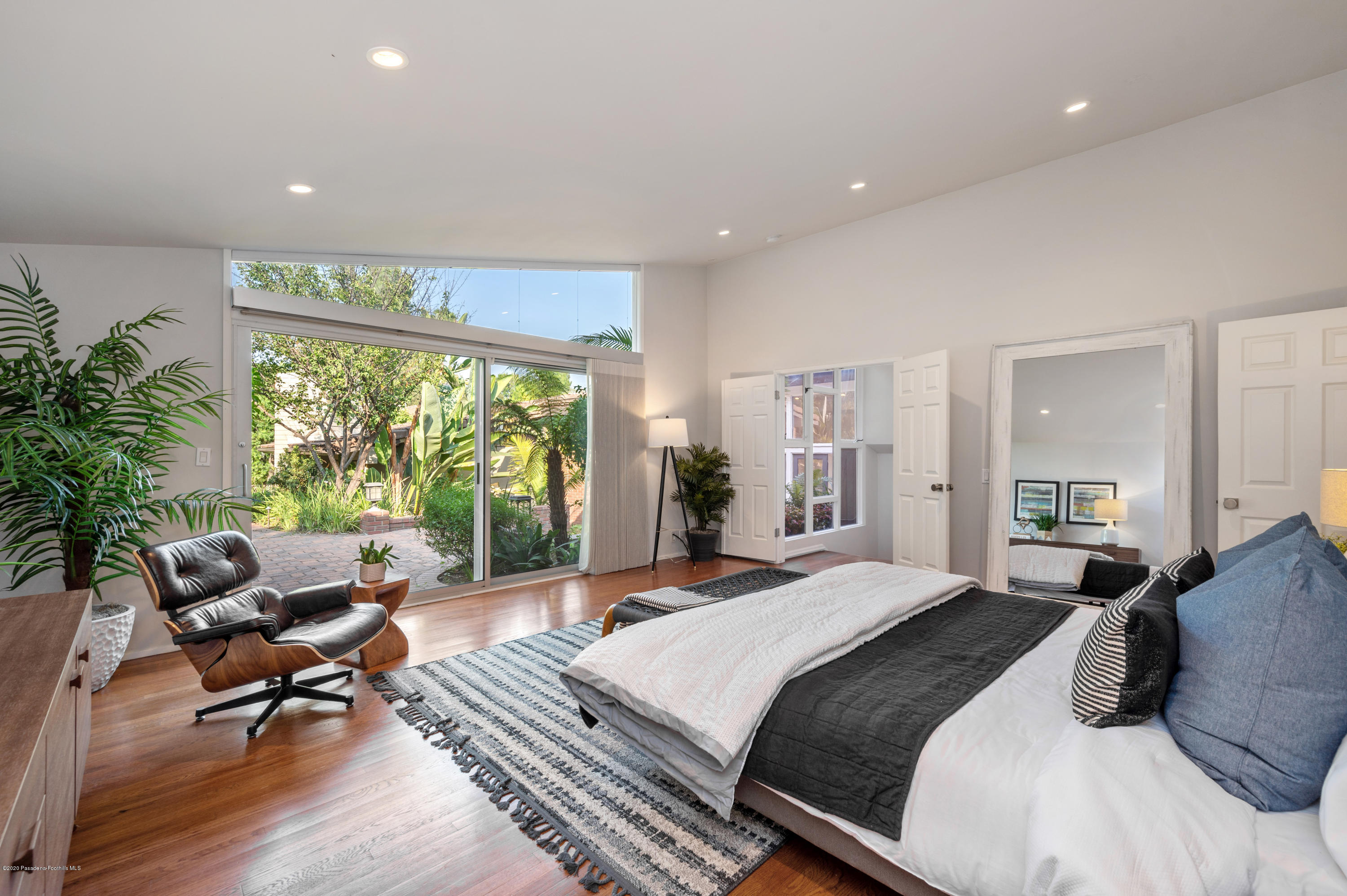 1225 Mesa Road San Marino, CA 91108 - Photo 29 of 48 a spacious bedroom with a large bed and a window