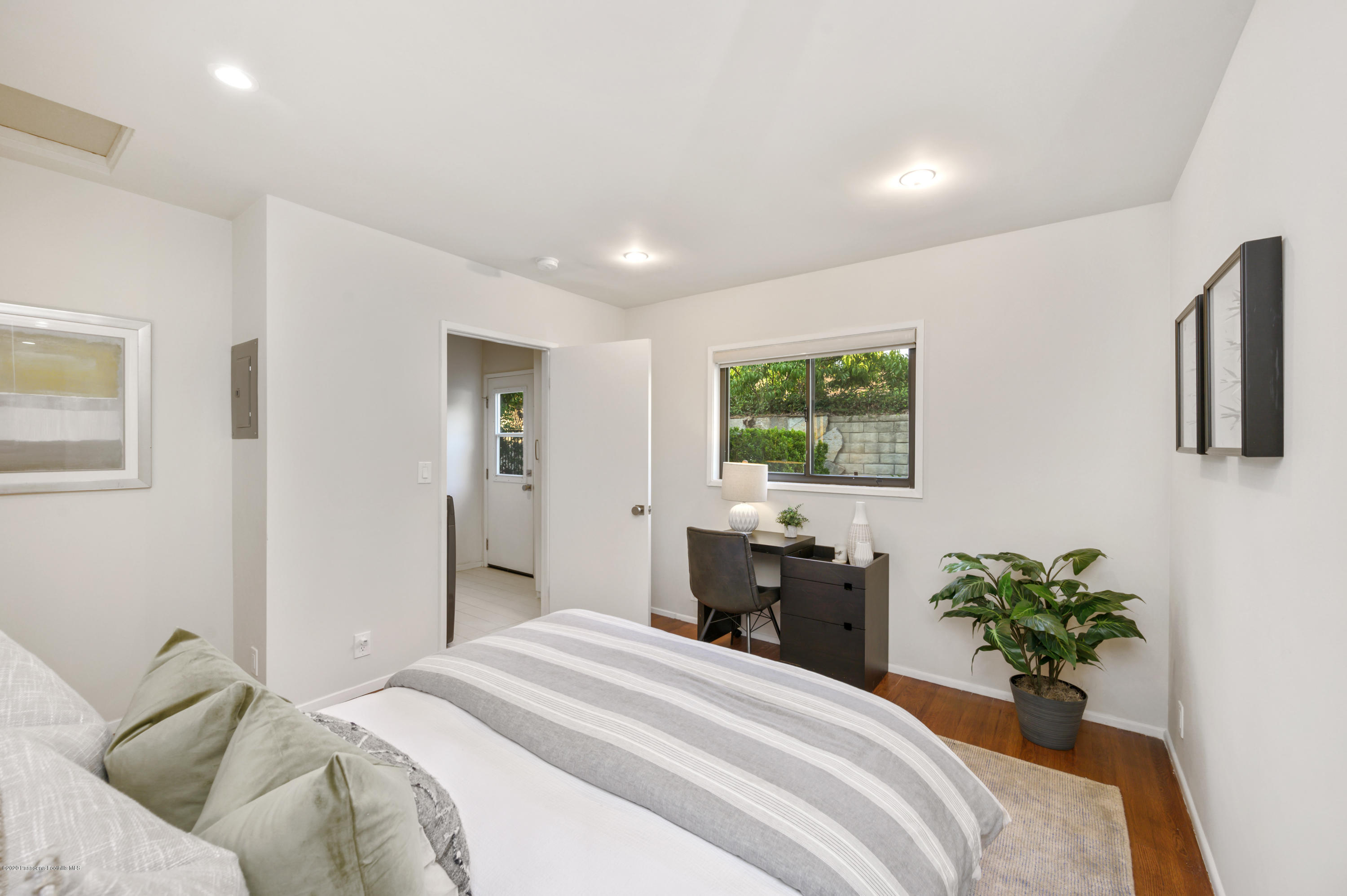 1225 Mesa Road San Marino, CA 91108 - Photo 31 of 48 a bedroom with a bed and a potted plant