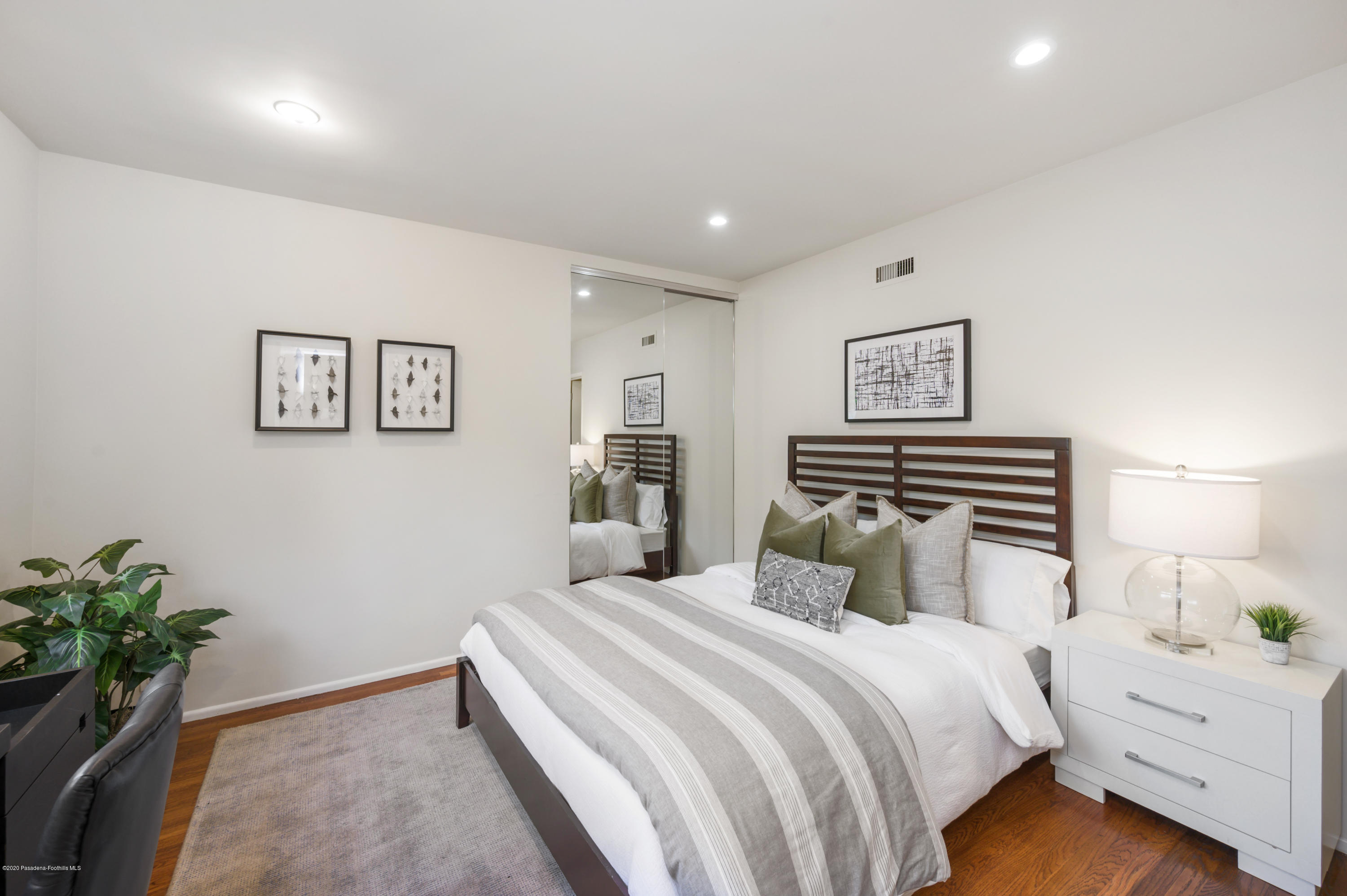 1225 Mesa Road San Marino, CA 91108 - Photo 32 of 48 a bedroom with a bed and a potted plant