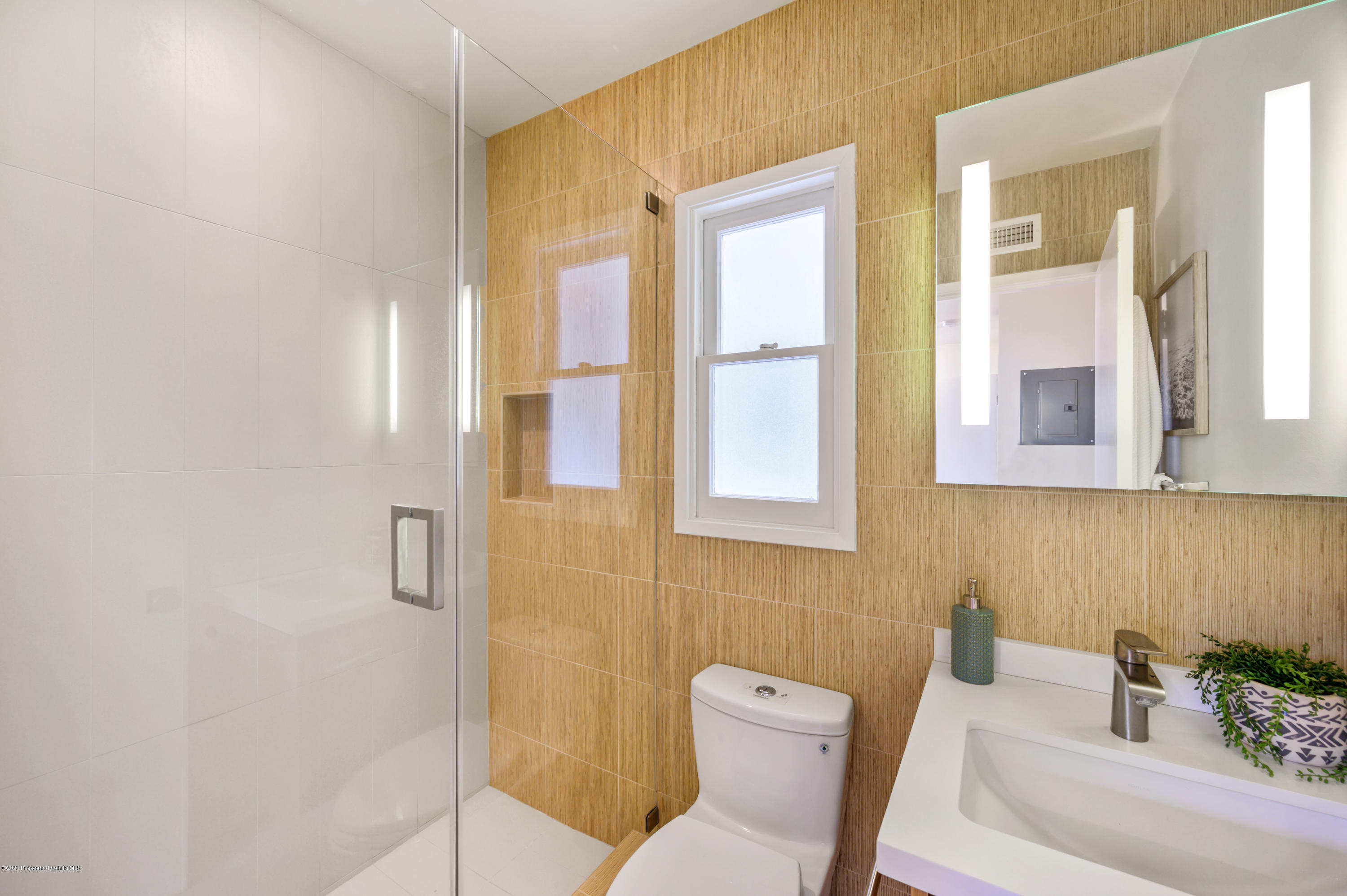 1225 Mesa Road San Marino, CA 91108 - Photo 33 of 48 a bathroom with a toilet sink and mirror