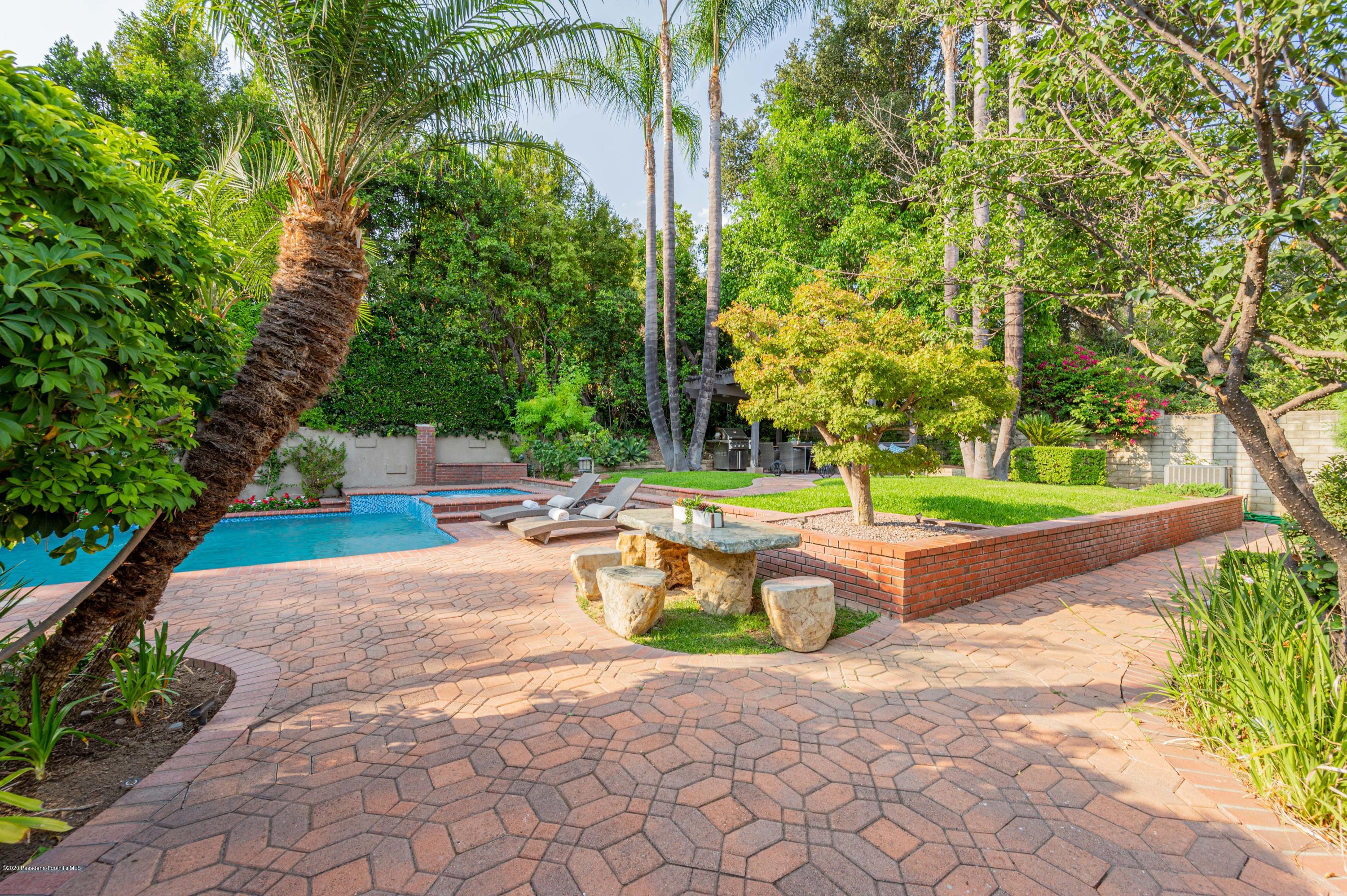 1225 Mesa Road San Marino, CA 91108 - Photo 40 of 48 a view of a fountain with plants in front of house