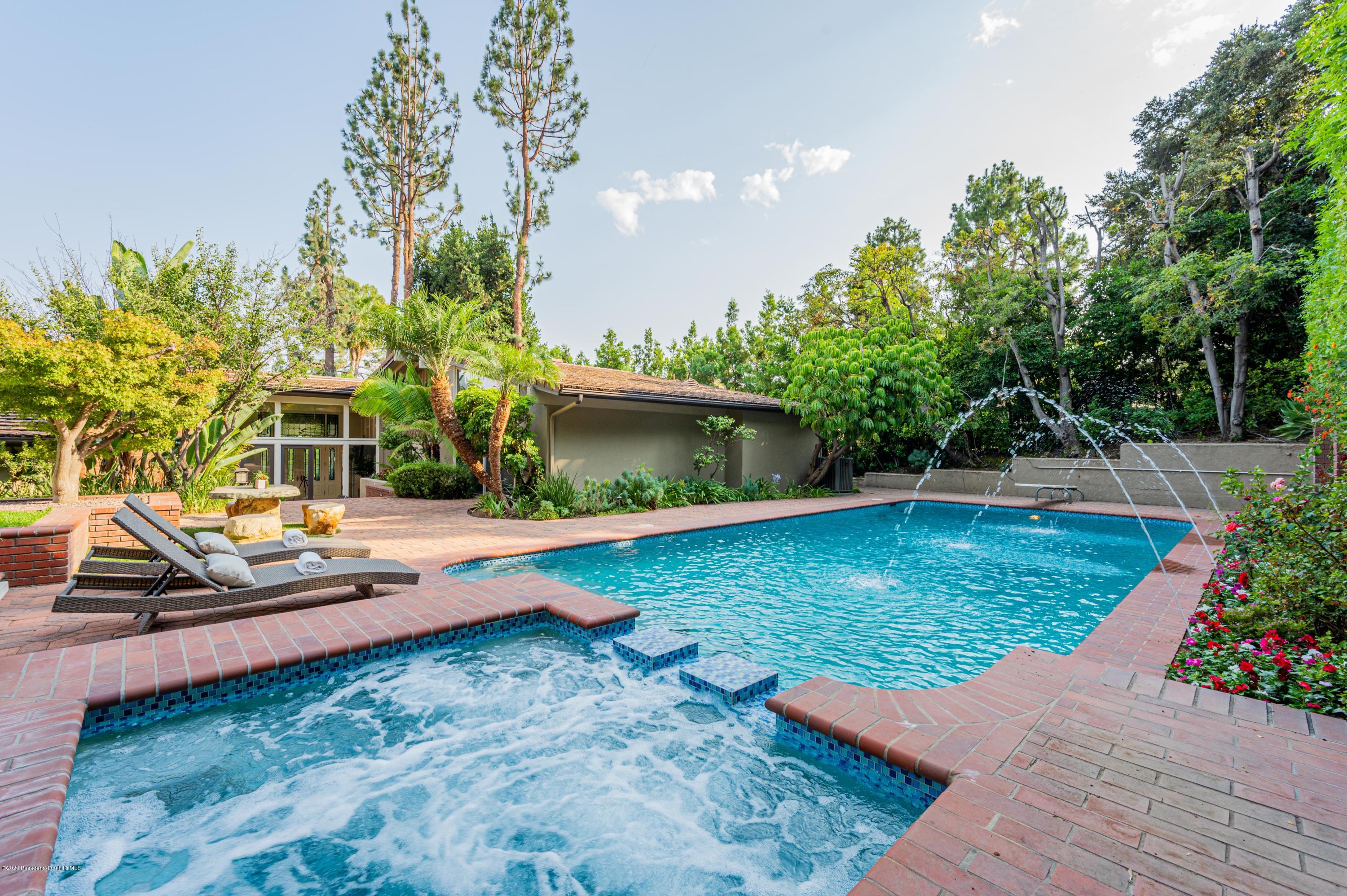 1225 Mesa Road San Marino, CA 91108 - Photo 42 of 48 a view of a swimming pool with a patio