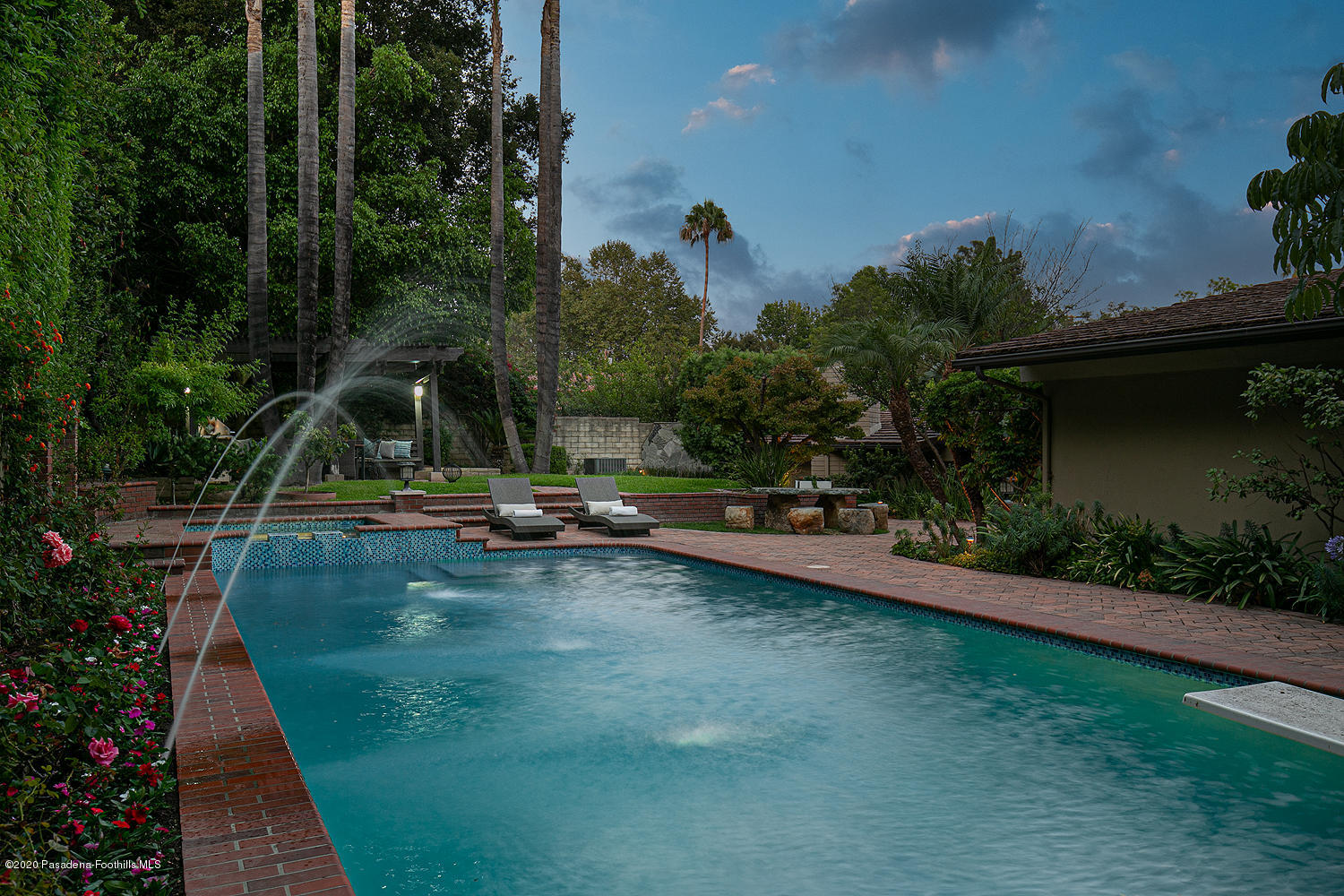 1225 Mesa Road San Marino, CA 91108 - Photo 43 of 48 a view of a swimming pool with a garden and trees