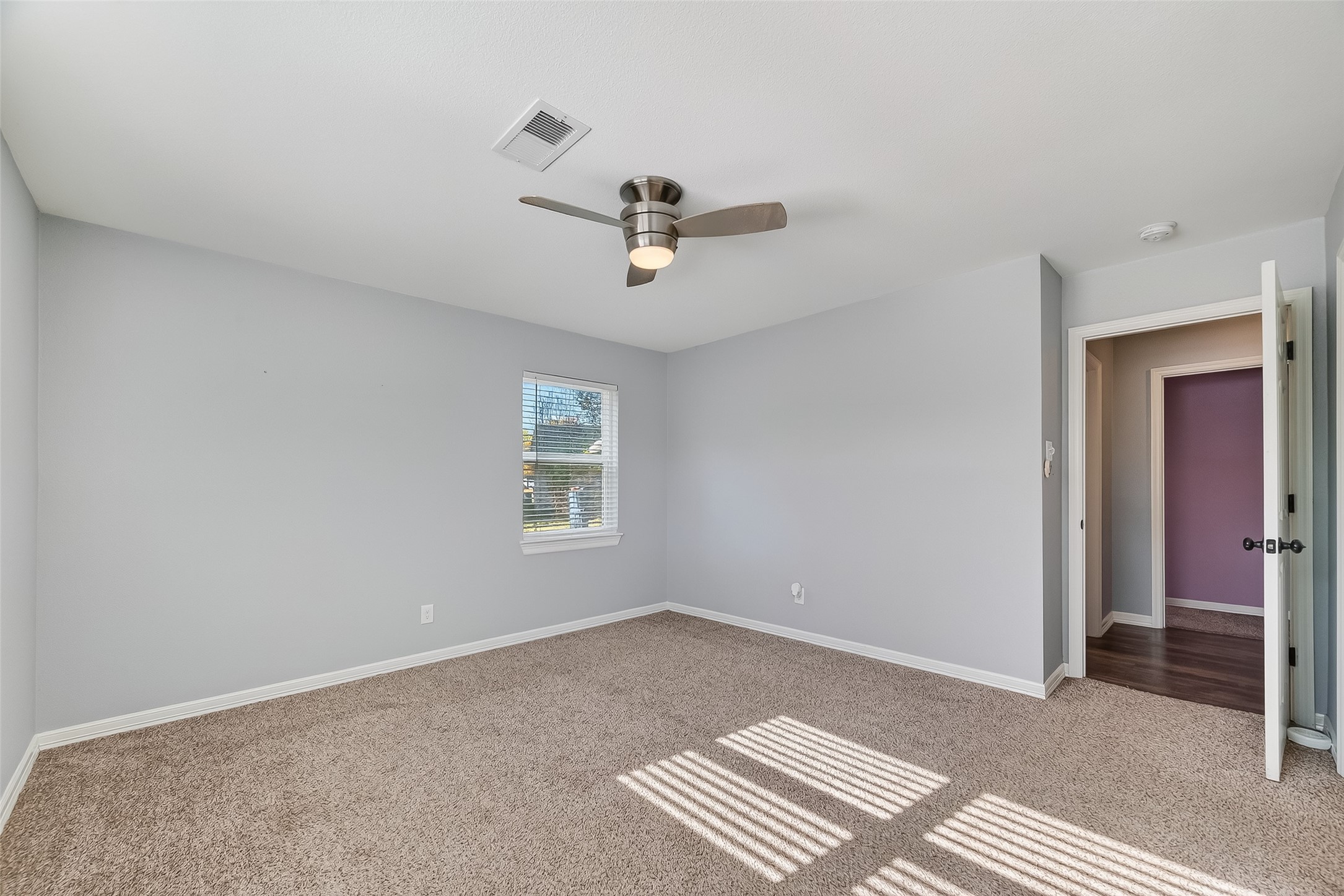 12430 Eiker Road Pearland, TX 77581 - Photo 18 of 41 a view of room with a ceiling fan and window