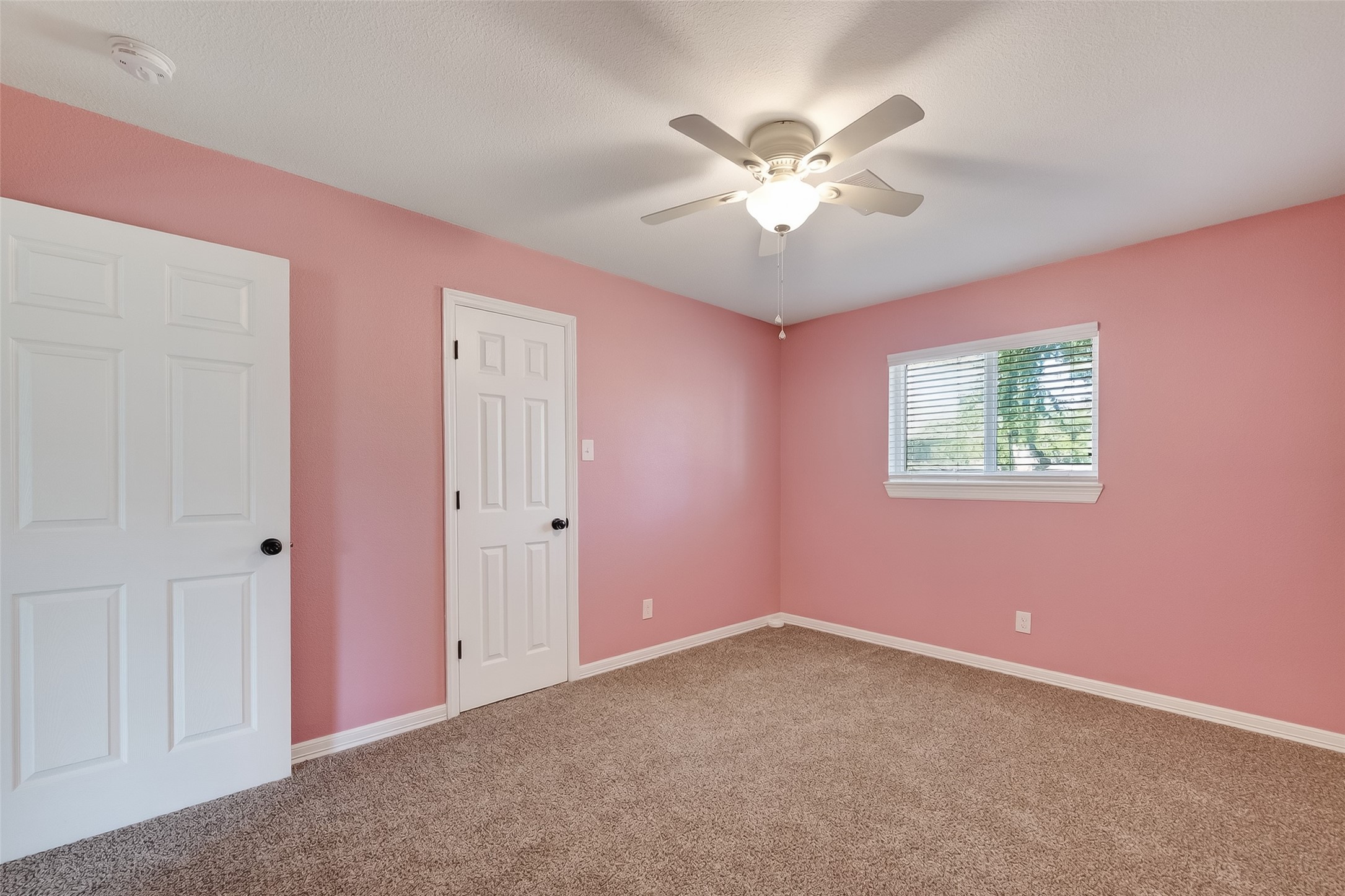 12430 Eiker Road Pearland, TX 77581 - Photo 24 of 41 a view of an empty room with chandelier fan