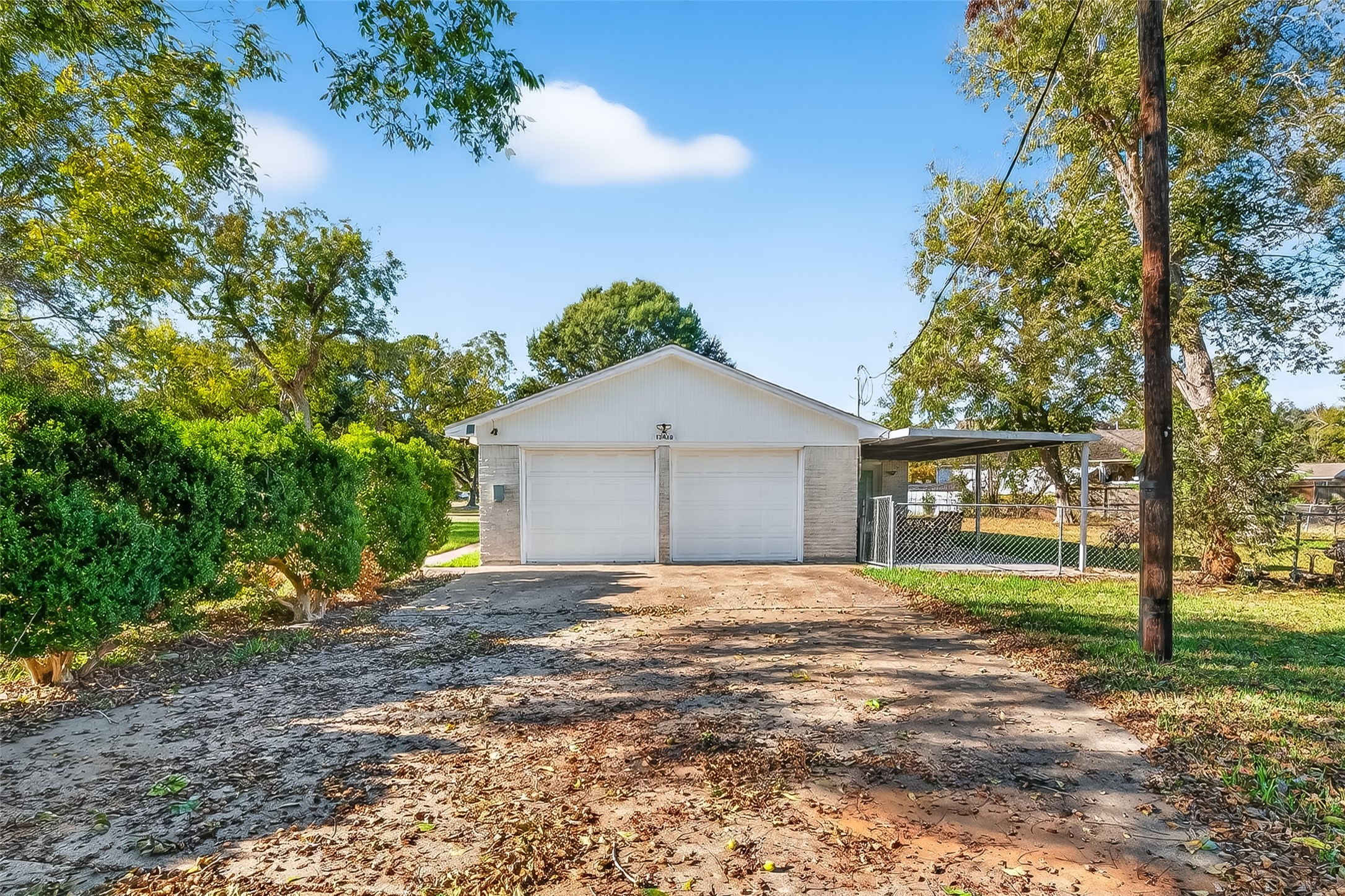 12430 Eiker Road Pearland, TX 77581 - Photo 28 of 41 a front view of a house with a yard and garage