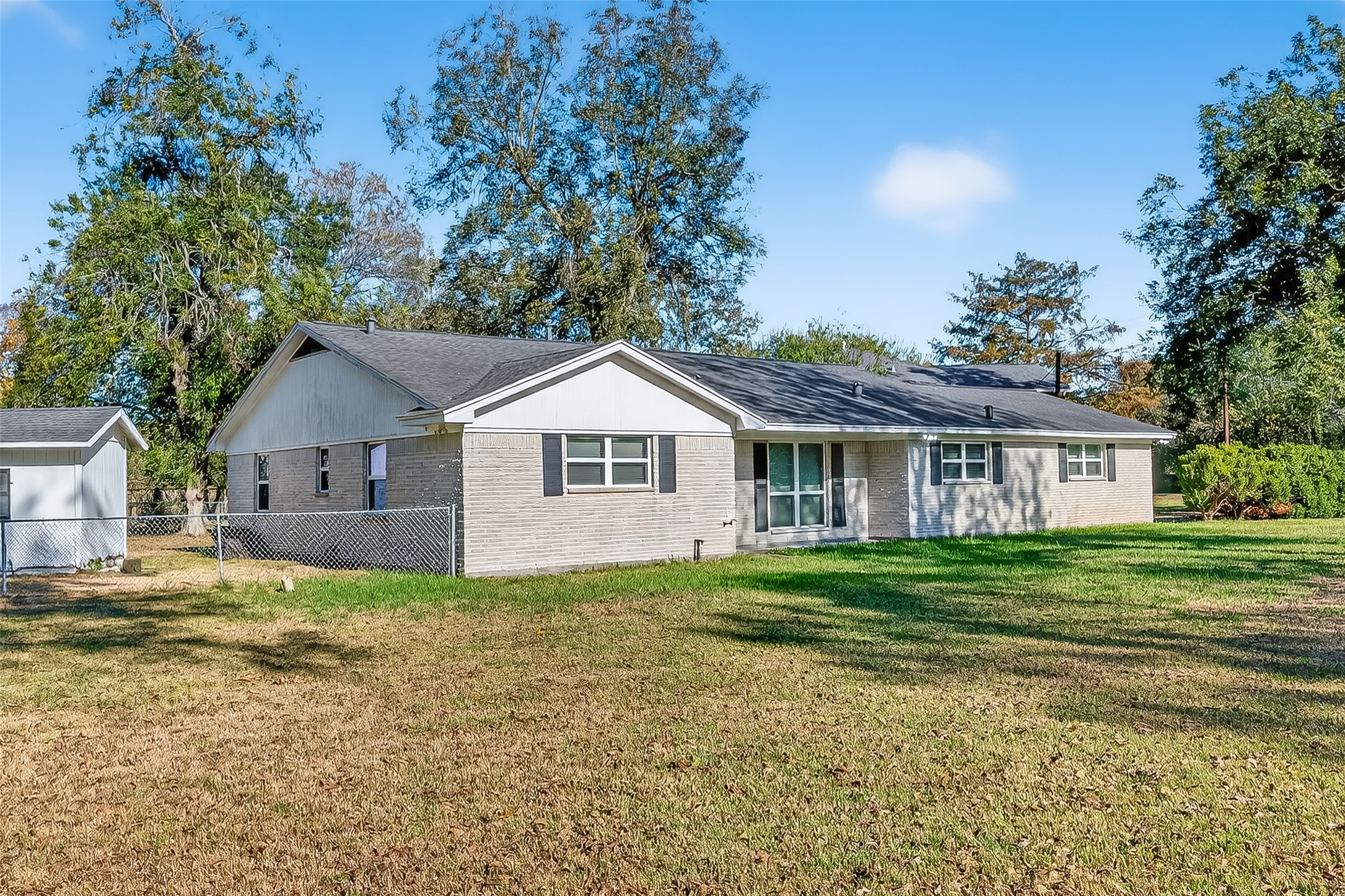 12430 Eiker Road Pearland, TX 77581 - Photo 34 of 41 a front view of a house with a yard and trees