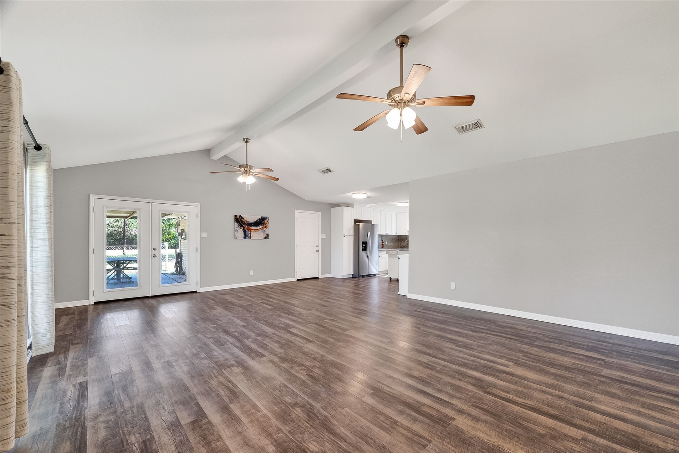 12430 Eiker Road Pearland, TX 77581 - Photo 7 of 41 wooden floor in an empty room with a window