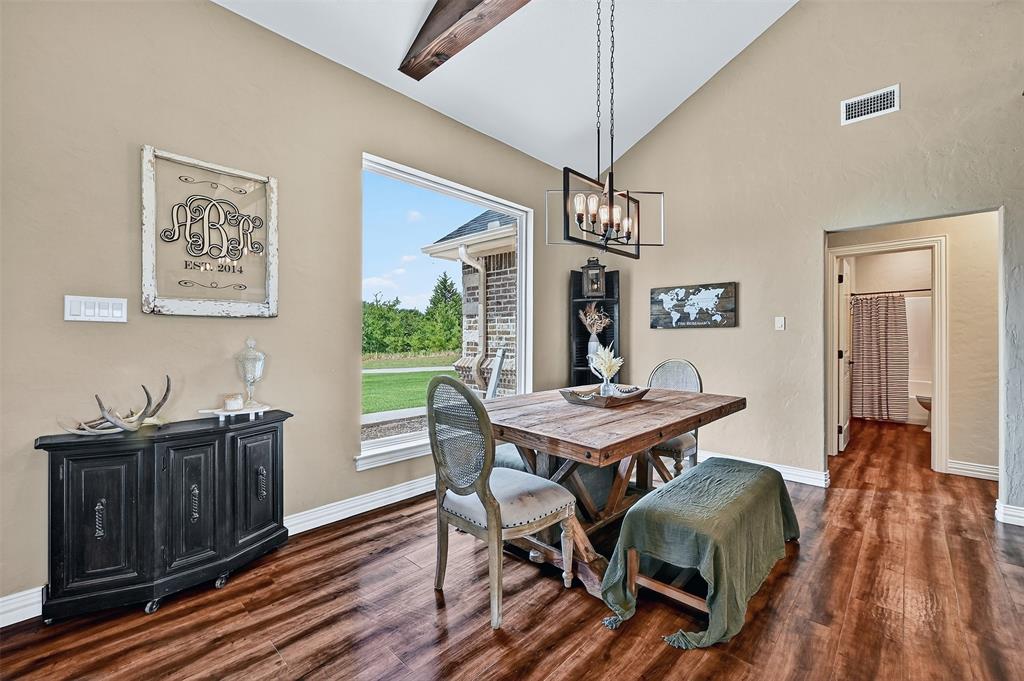 2340 Wright Road Sherman, TX 75092 - Photo 15 of 40 a view of a dining room with furniture window and wooden floor