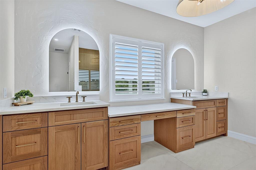 2340 Wright Road Sherman, TX 75092 - Photo 19 of 40 a spacious bathroom with 2 sink and a large mirror