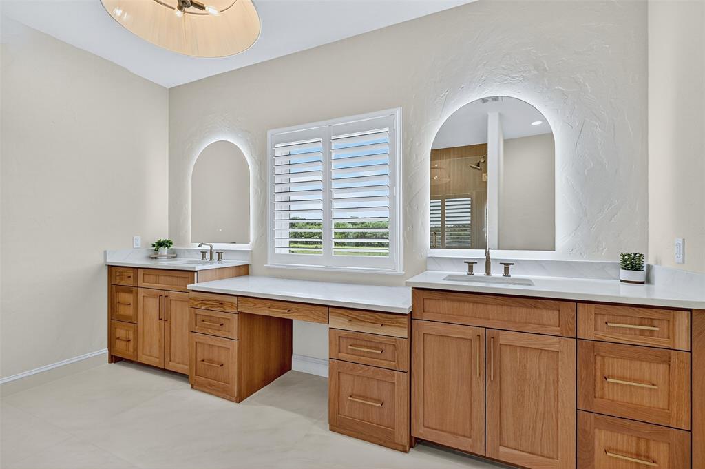 2340 Wright Road Sherman, TX 75092 - Photo 22 of 40 a spacious bathroom with a granite countertop sink a mirror and a bathtub