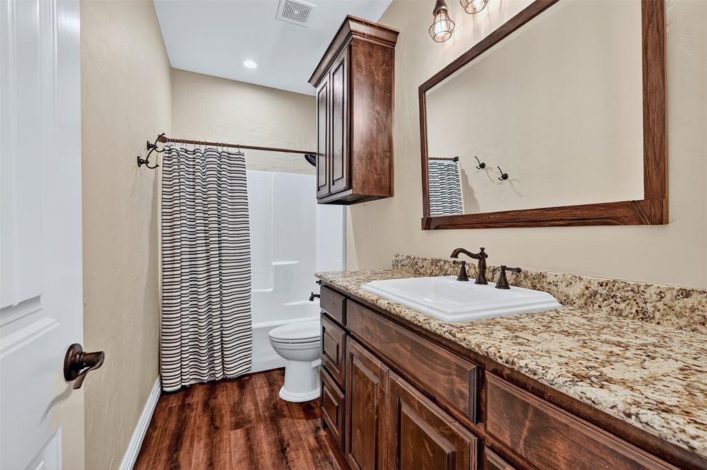 2340 Wright Road Sherman, TX 75092 - Photo 24 of 40 a bathroom with a sink and a mirror