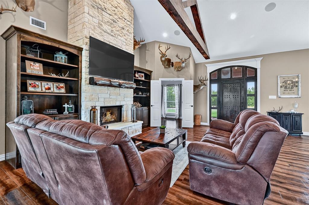 2340 Wright Road Sherman, TX 75092 - Photo 7 of 40 a living room with furniture a fireplace and a flat screen tv