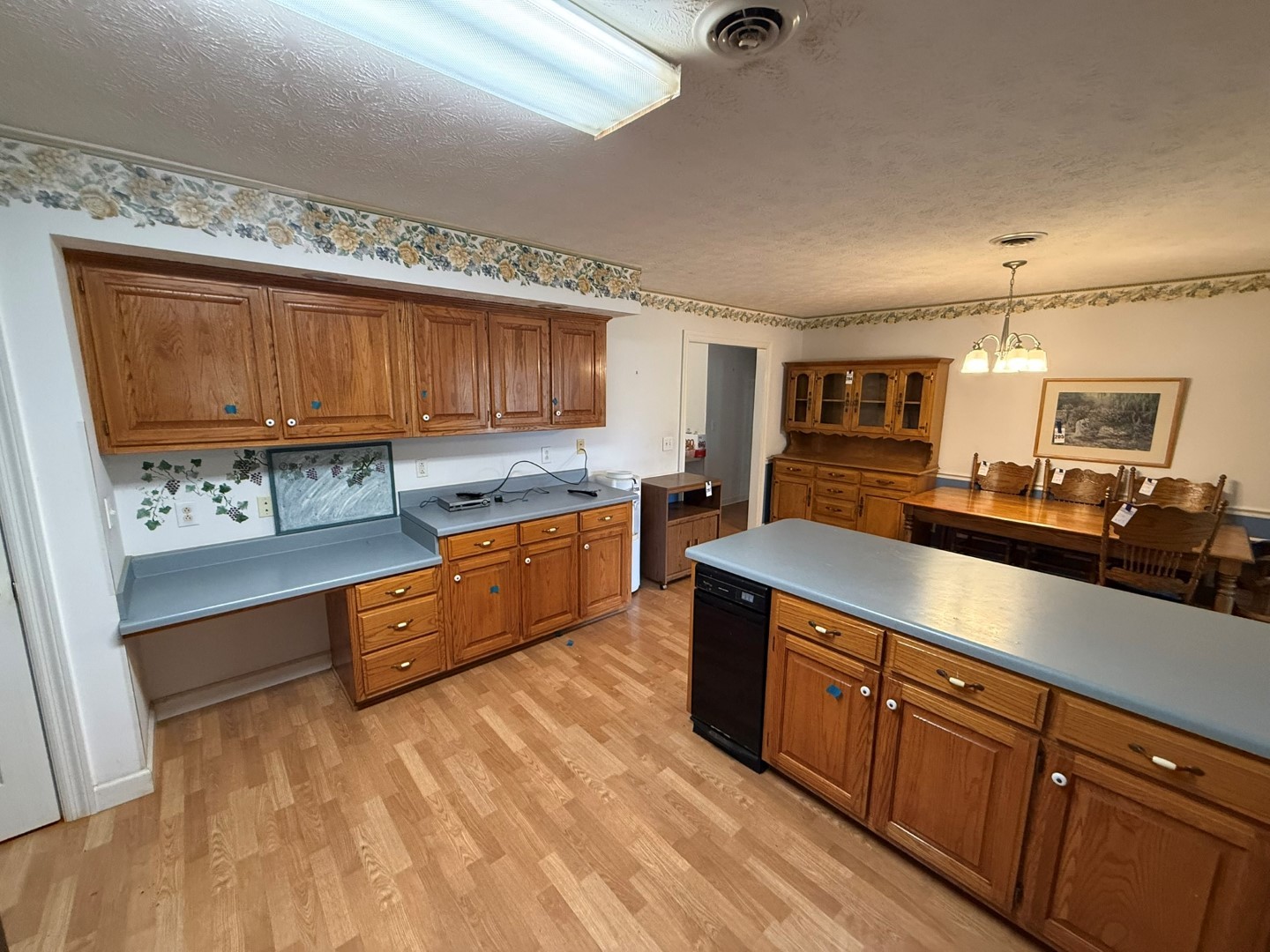 4197 Betty Ford Road Murfreesboro, TN 37130 - Photo 15 of 27 a large kitchen with stainless steel appliances granite countertop a stove a sink dishwasher and cabinets with wooden floor