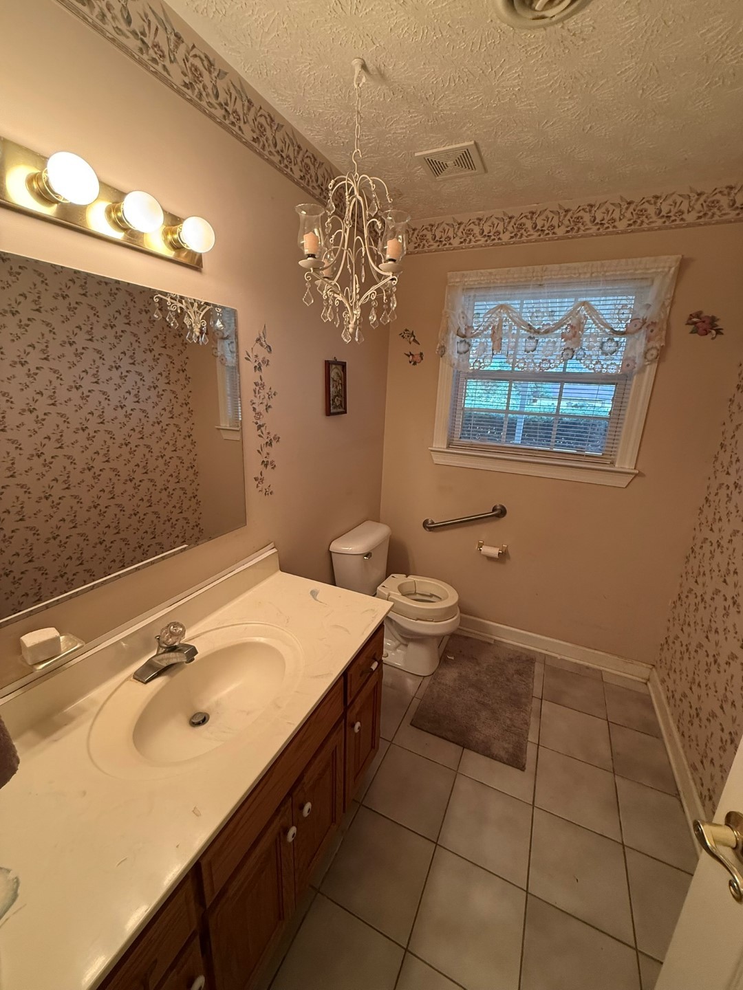 4197 Betty Ford Road Murfreesboro, TN 37130 - Photo 25 of 27 a bathroom with a sink a vanity and a mirror
