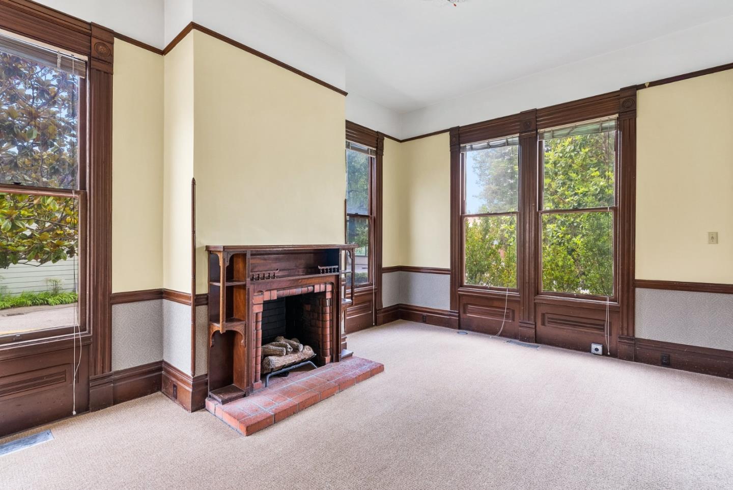 603 Mission Street Santa Cruz, CA 95060 - Photo 15 of 77 a view of livingroom with furniture fireplace and windows