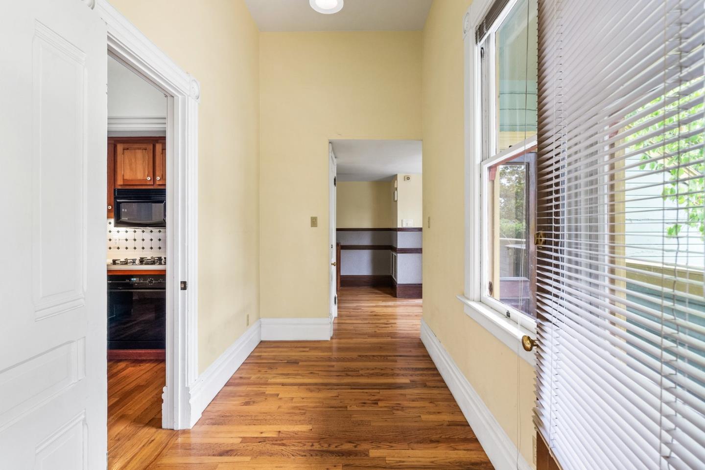 603 Mission Street Santa Cruz, CA 95060 - Photo 18 of 77 a view of a hallway with wooden floor and staircase