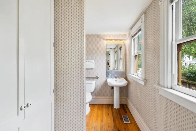 a living room with furniture a couch and a large window