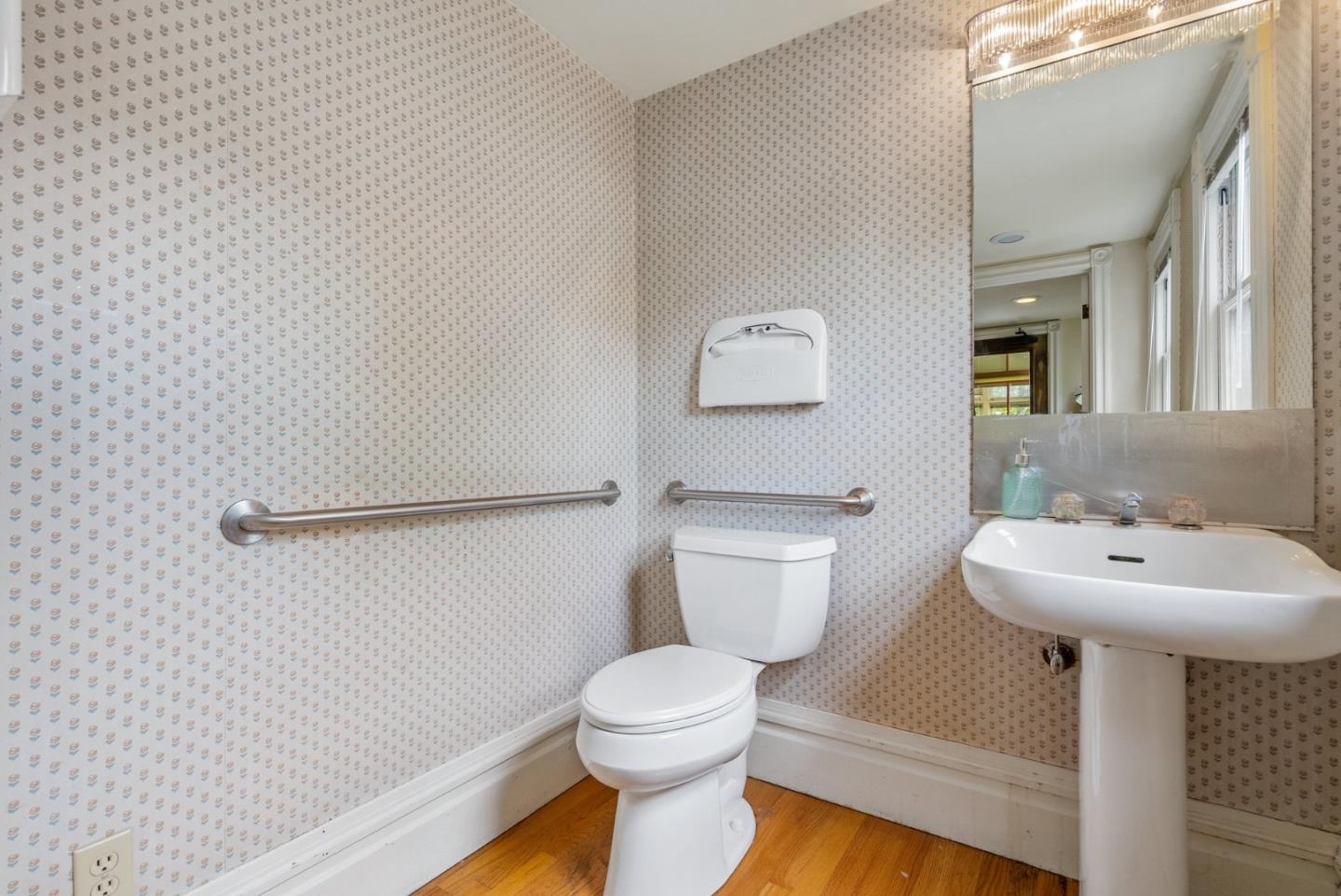 603 Mission Street Santa Cruz, CA 95060 - Photo 26 of 77 a bathroom with a sink toilet and a mirror