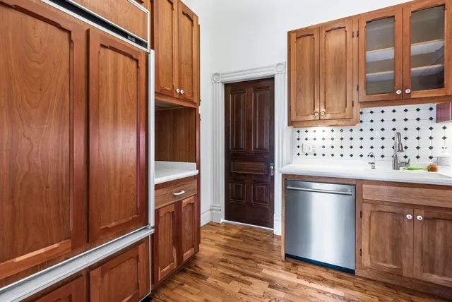 a dining room with furniture and a window