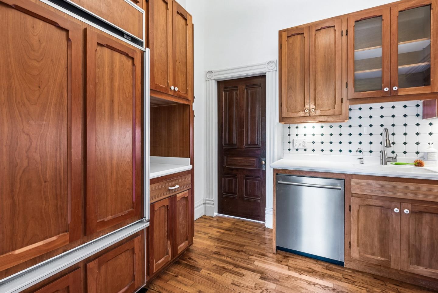 603 Mission Street Santa Cruz, CA 95060 - Photo 29 of 77 a kitchen with granite countertop wooden cabinets and stainless steel appliances