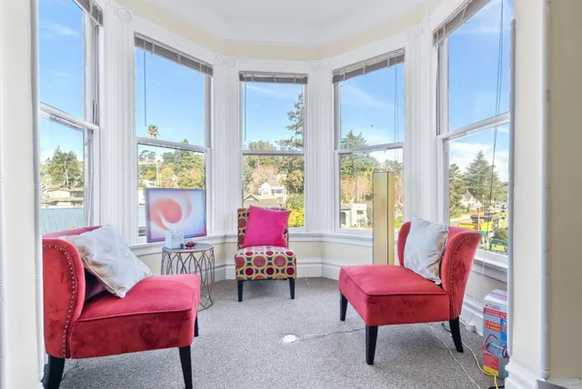 a bedroom with furniture and a book shelf