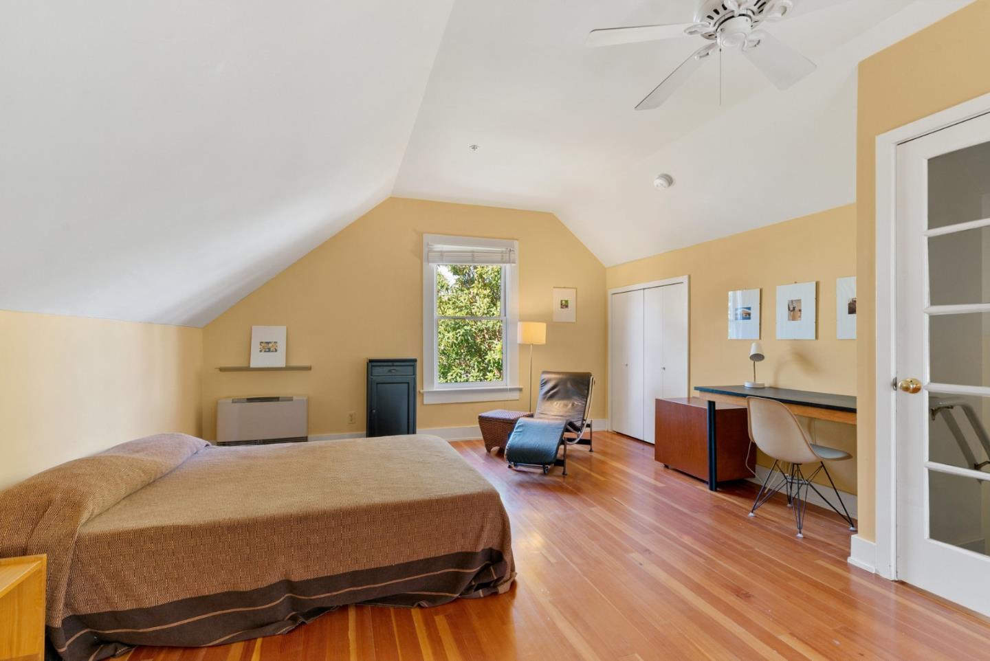 603 Mission Street Santa Cruz, CA 95060 - Photo 69 of 77 a bedroom with a bed and wooden floor