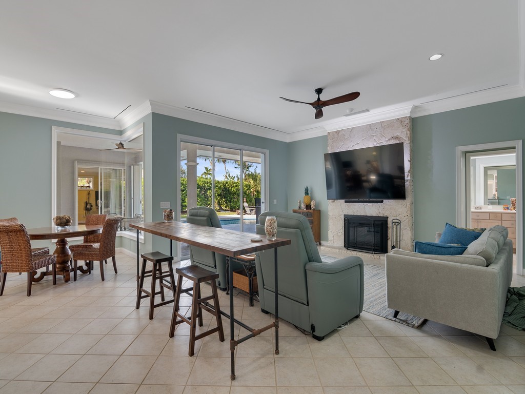 1 Cache Cay Drive Vero Beach, FL 32963 - Photo 15 of 36 a living room with furniture a fireplace and a flat screen tv