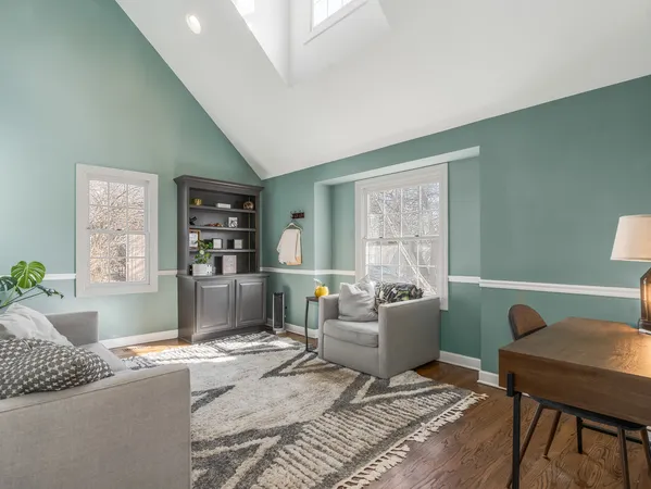 a living room with furniture and a rug