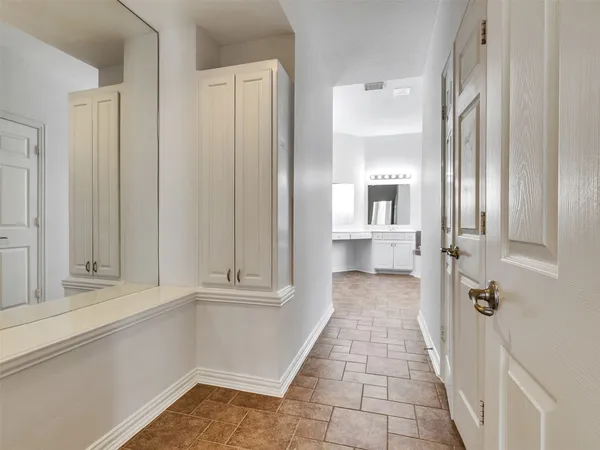 a view of a bathroom with sink and mirror
