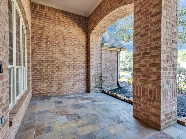 a view of entryway with a brick wall