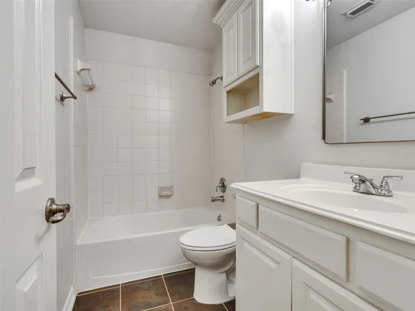 a bathroom with a sink a toilet and a bathtub