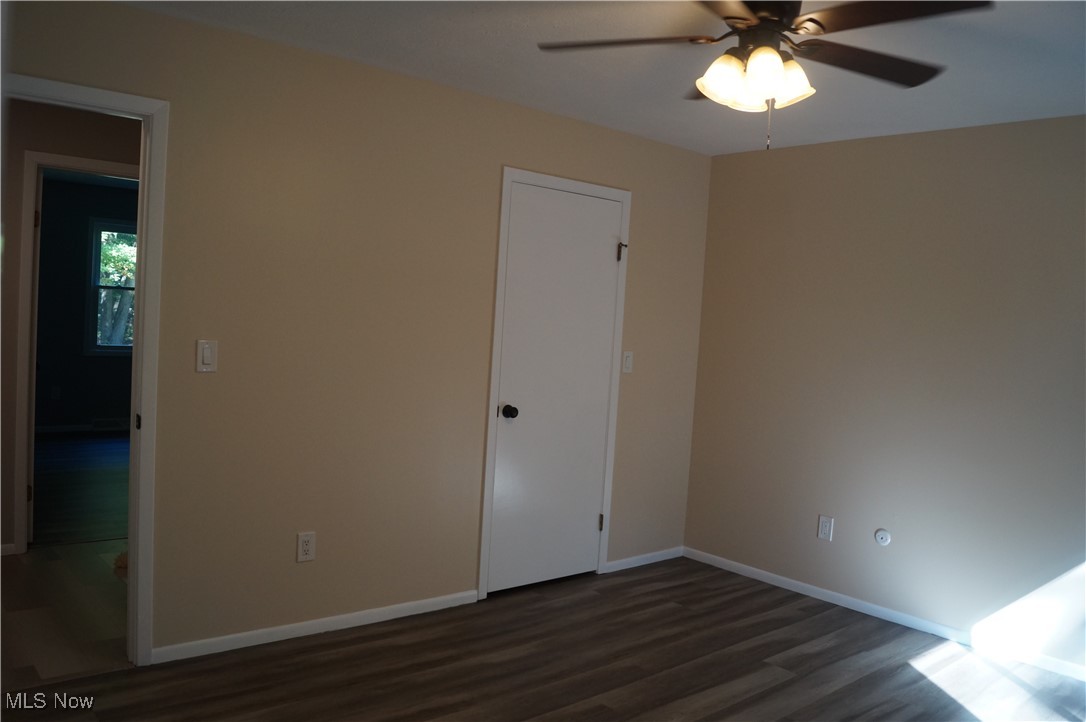 7372 Liberty Road Solon, OH 44139 - Photo 13 of 33 Owners bedroom featuring LVP floors, a ceiling fan, and a closet, door to bathroom