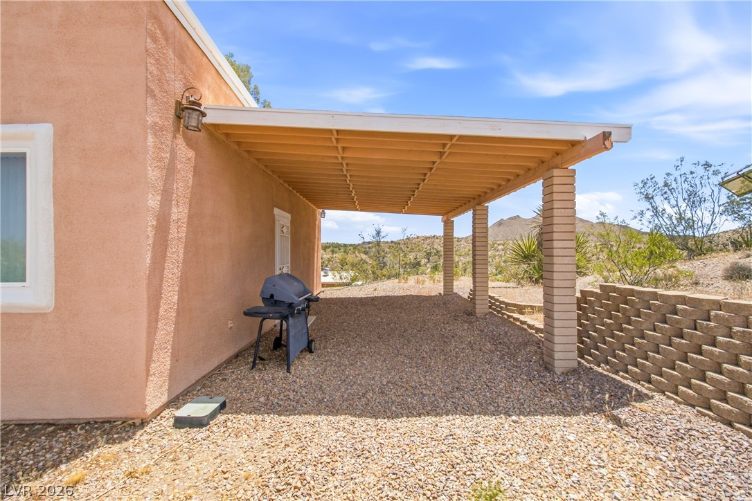 Rocking S Ranch Road Searchlight, NV 89046 - Photo 15 of 47 A spacious covered patio provides an ideal setting for outdoor entertaining, boasting panoramic desert and mountain views.