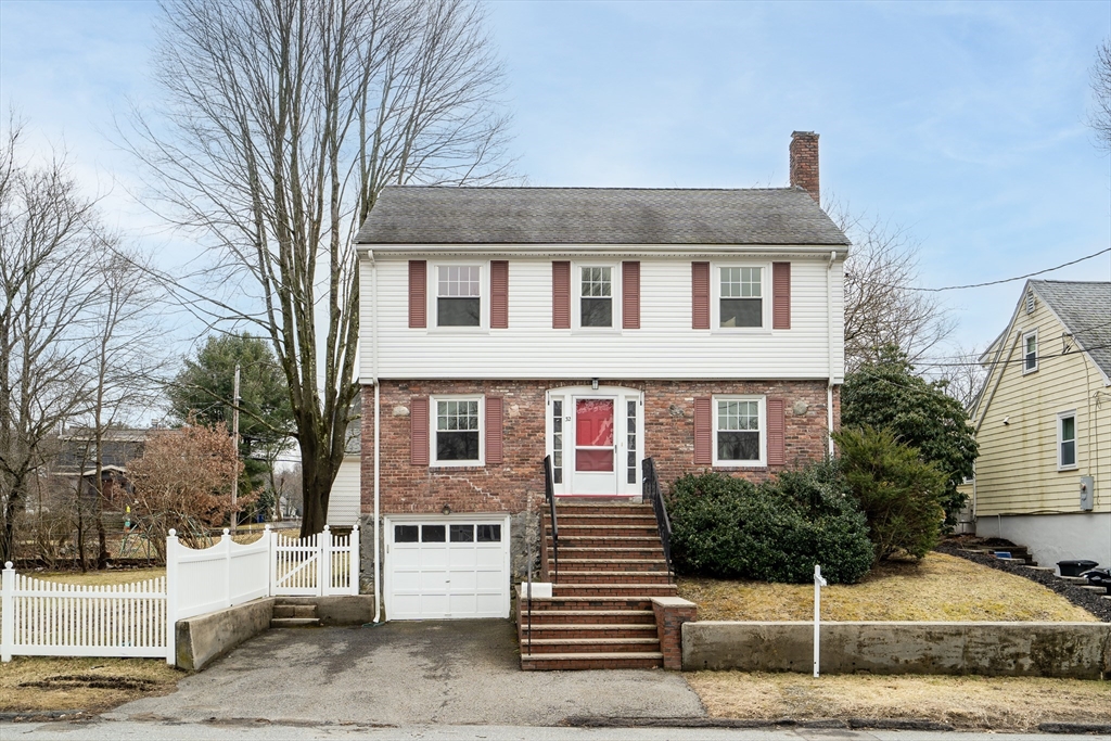 32 Valentine Road Arlington, MA 02476 - Photo 1 of 38 a front view of a house with garage