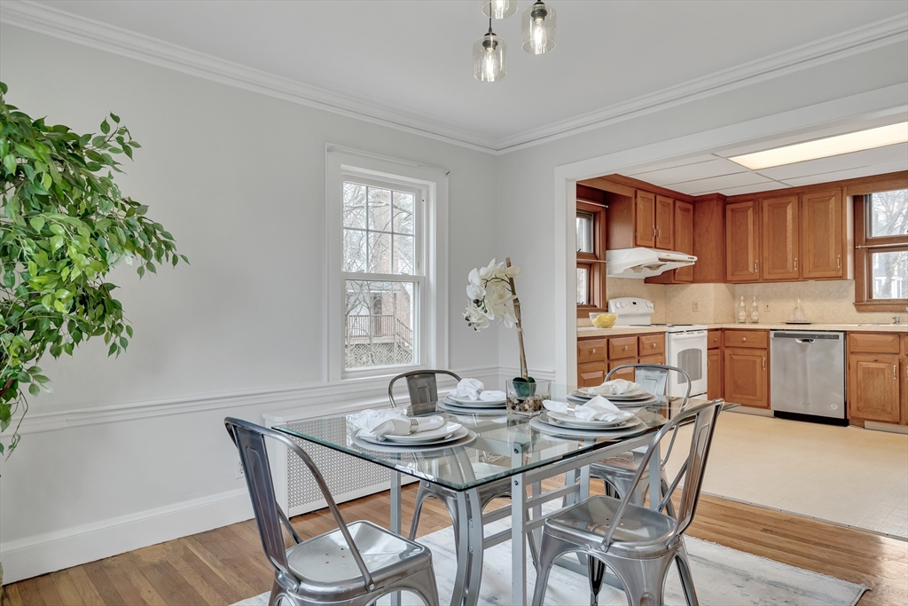 32 Valentine Road Arlington, MA 02476 - Photo 11 of 38 a kitchen with a table and chairs in it