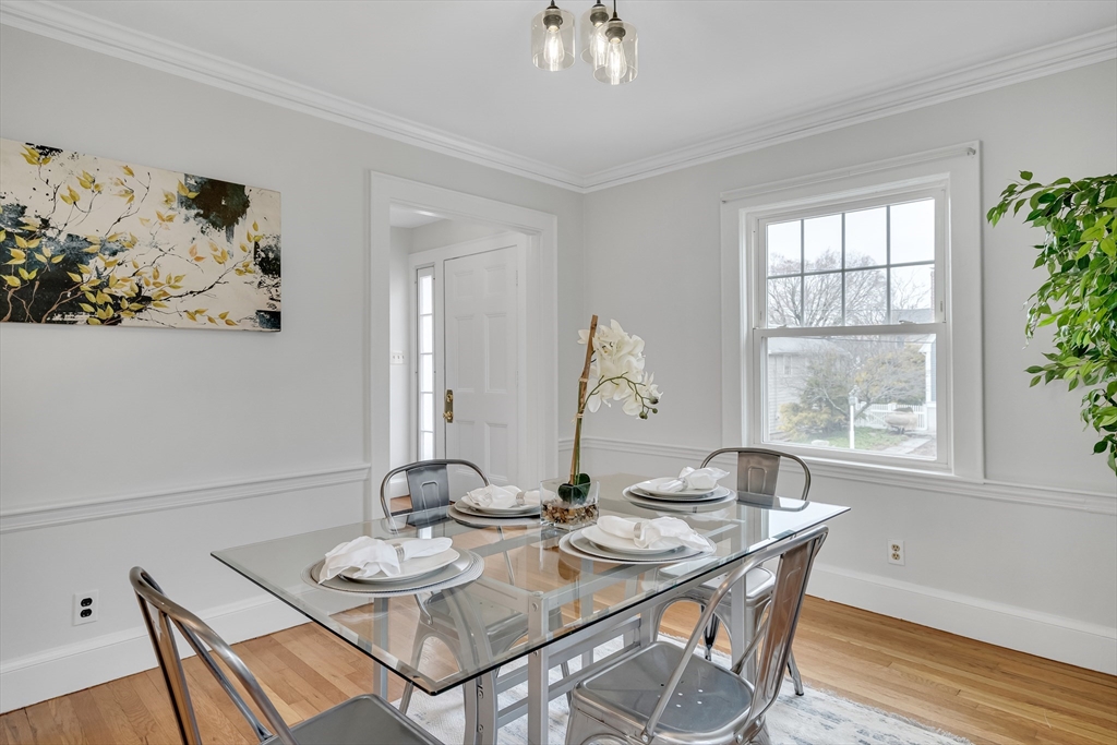 32 Valentine Road Arlington, MA 02476 - Photo 13 of 38 a view of a dining room with furniture window and wooden floor