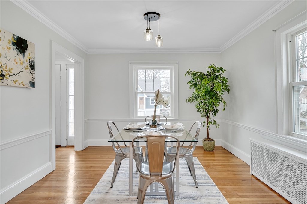 32 Valentine Road Arlington, MA 02476 - Photo 15 of 38 a view of a dining room with furniture window and wooden floor