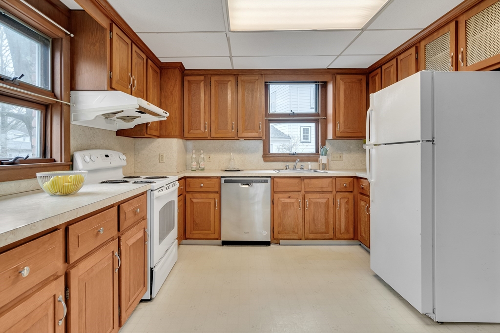 32 Valentine Road Arlington, MA 02476 - Photo 16 of 38 a kitchen with stainless steel appliances a white cabinets and a sink