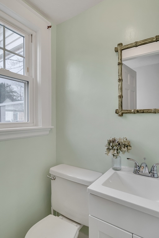32 Valentine Road Arlington, MA 02476 - Photo 20 of 38 a bathroom with a sink a mirror and a toilet