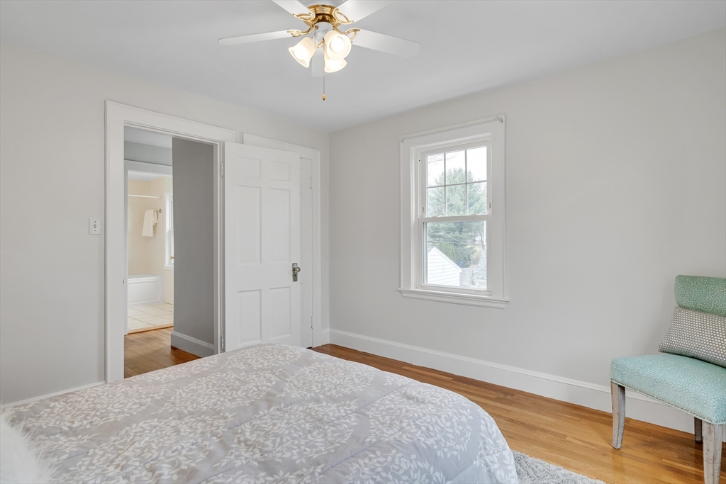 32 Valentine Road Arlington, MA 02476 - Photo 24 of 38 a bedroom with a bed and a chandelier