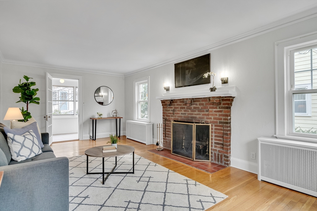 32 Valentine Road Arlington, MA 02476 - Photo 3 of 38 a living room with furniture and a fireplace