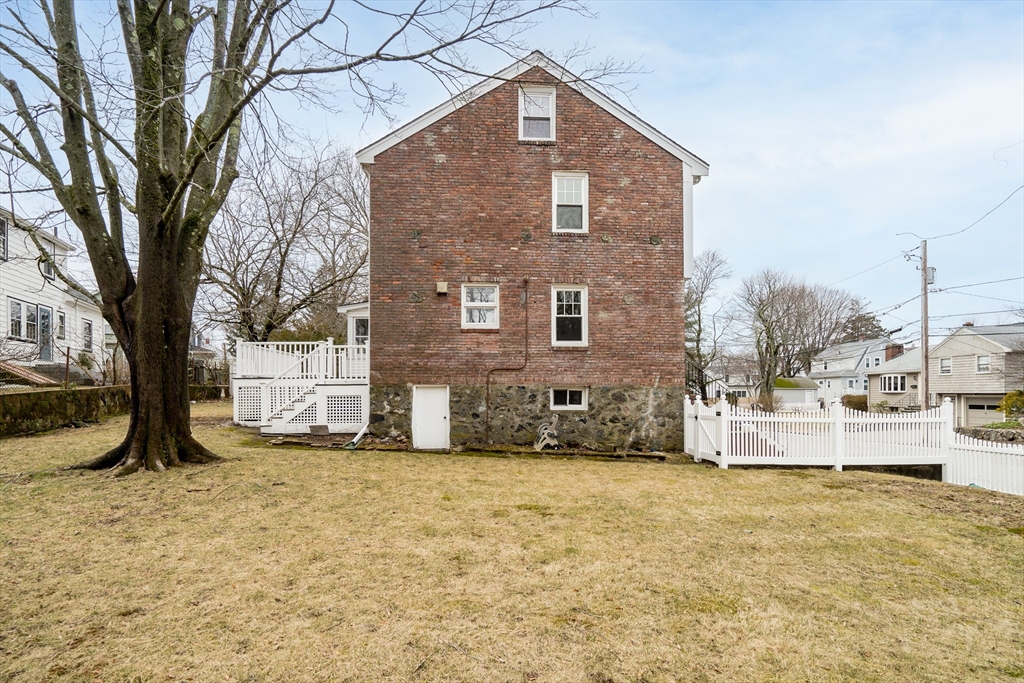 32 Valentine Road Arlington, MA 02476 - Photo 34 of 38 a view of a house with a large tree in the background