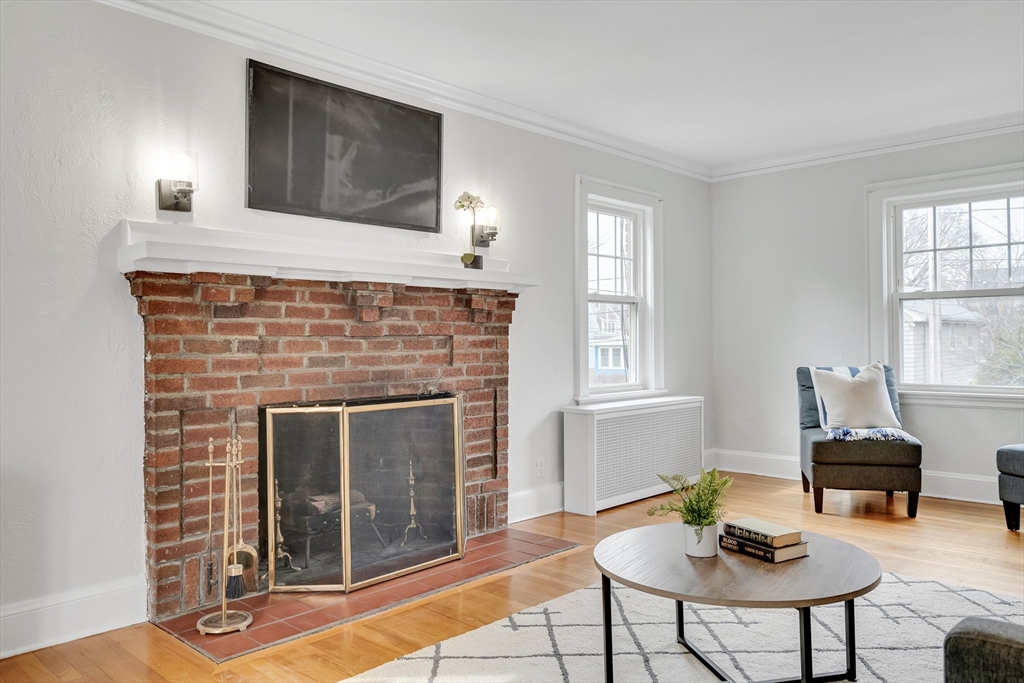 32 Valentine Road Arlington, MA 02476 - Photo 7 of 38 a living room with furniture and a fireplace