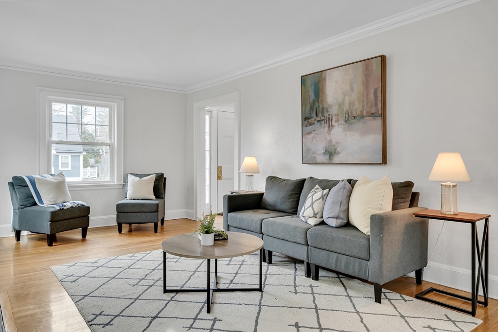 32 Valentine Road Arlington, MA 02476 - Photo 8 of 38 a living room with furniture and a lamp