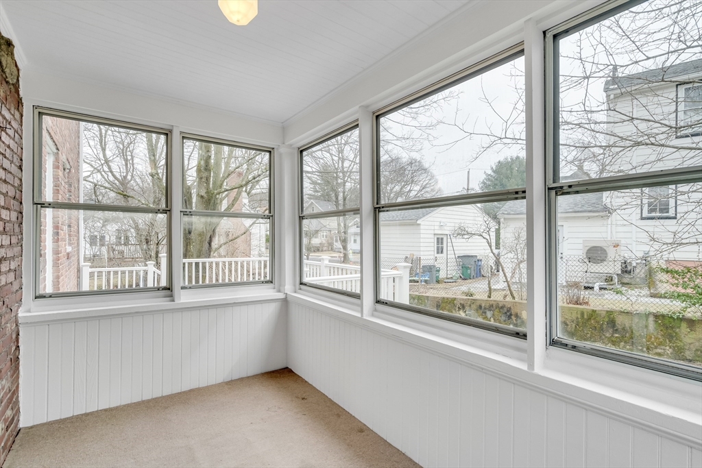 32 Valentine Road Arlington, MA 02476 - Photo 10 of 38 a view of an empty room with a large window